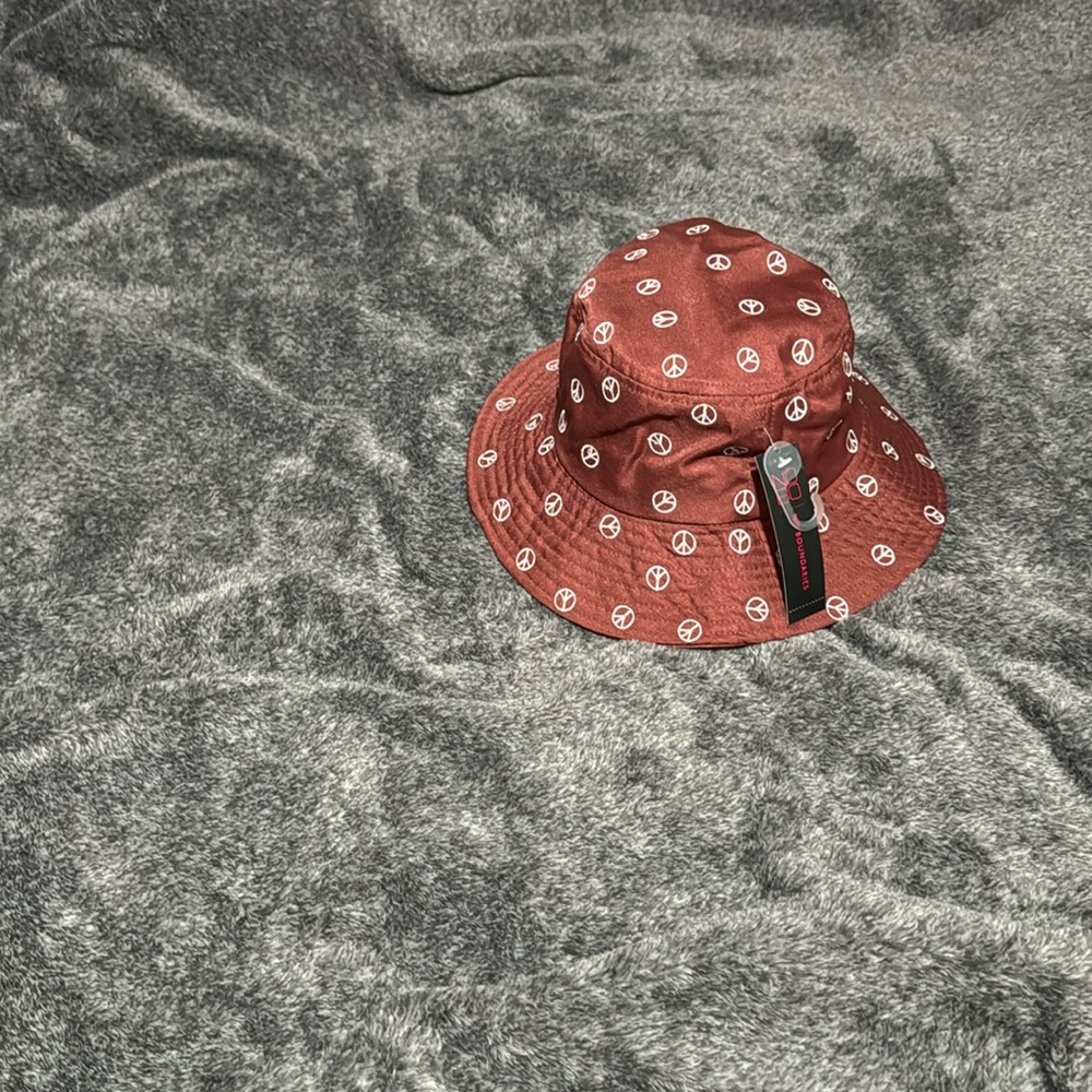 Peace Sign Bucket Hat, New with tags from Walmart. Rust in color.